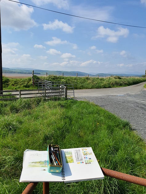 1st Pic. Watercolour sketching kit and paper on a railing looking out towards the mountains. 2nd pic. A park bench looking across a lake. Painting kit all set out ready for a painting session. 3rd pic. Sketching kit of pencils and a small pocket size sketchbook on a dry stone wall in the autumn time.