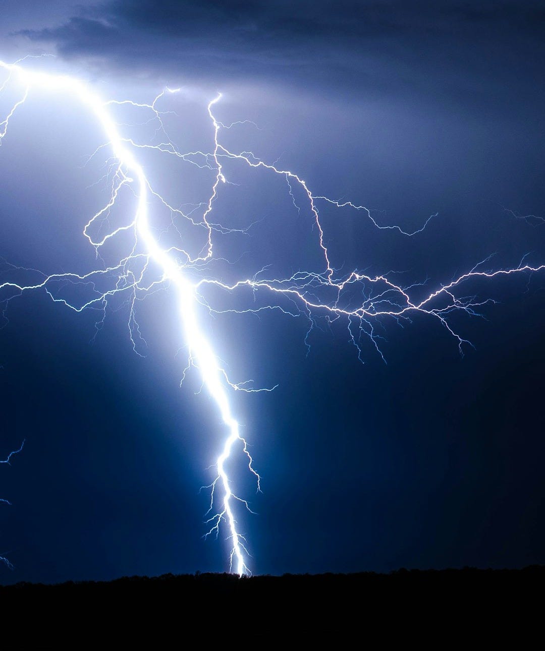 lightning strike during blue sky