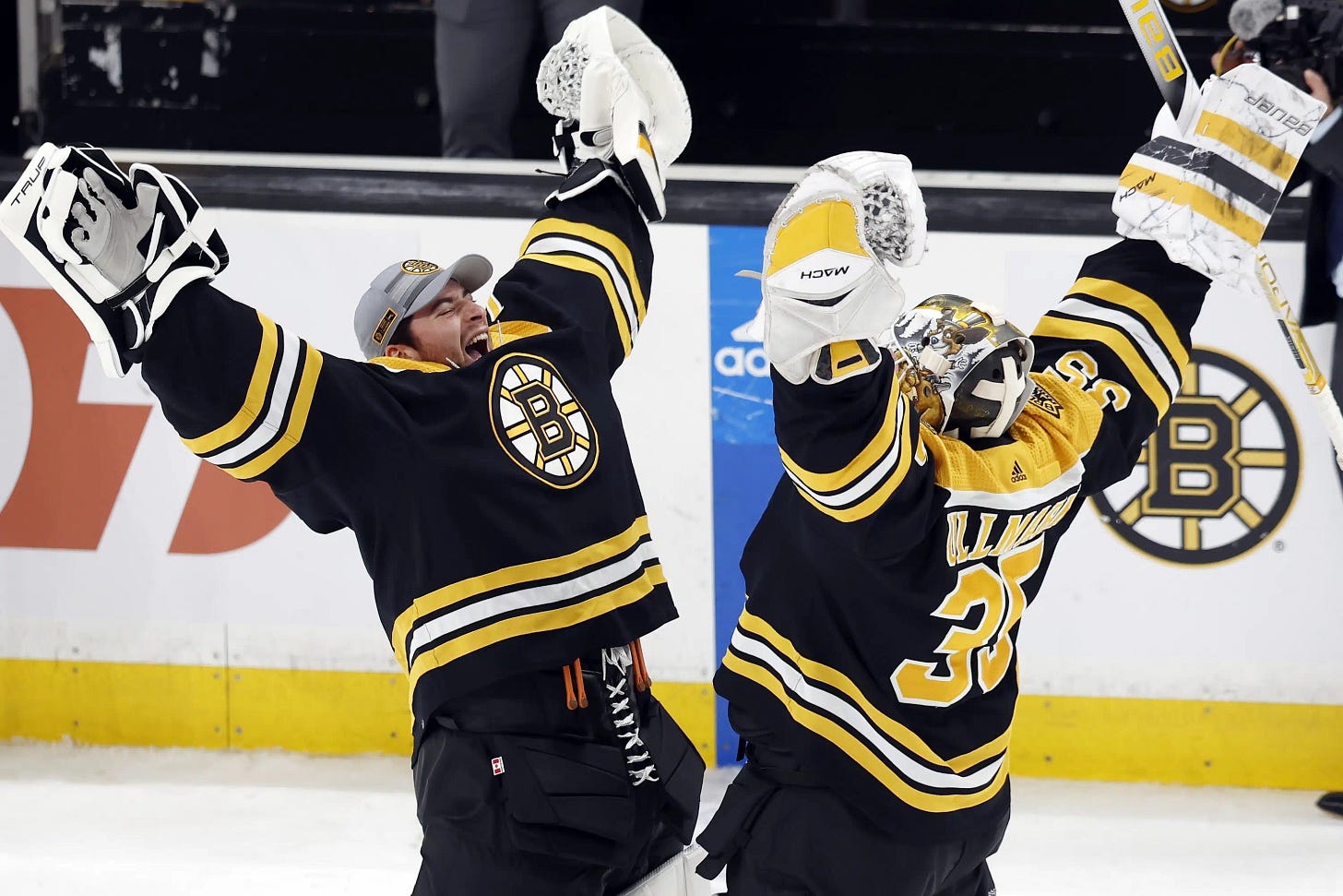 Bruins beat Devils 2-1, match NHL record with 62nd win | AP News