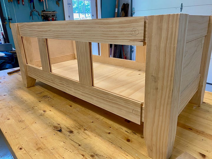 Dadoes and tenons being cut and wood pieces being dry-fit together