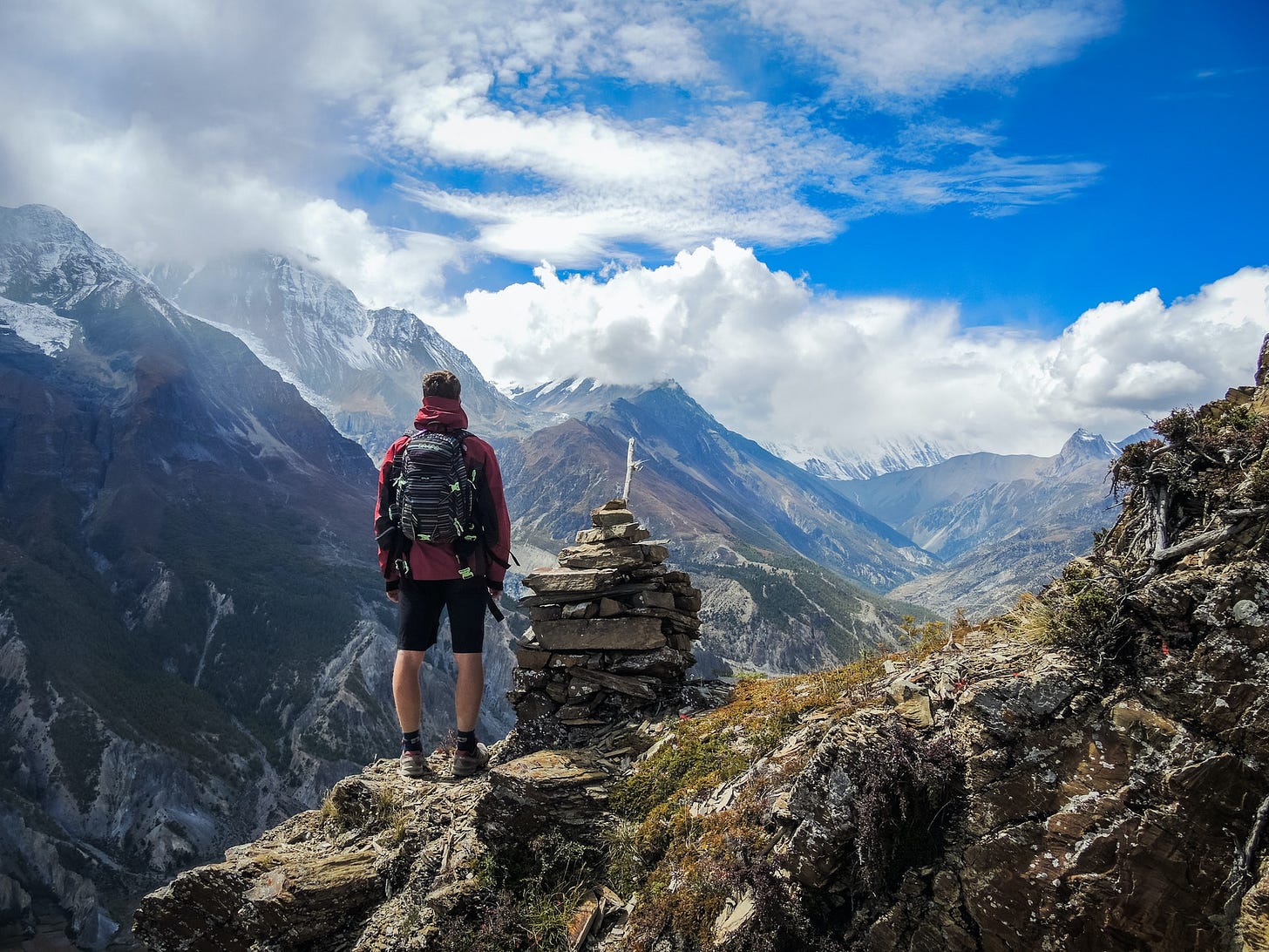 Hiker standing on mountain top Hiker standing on mountain top