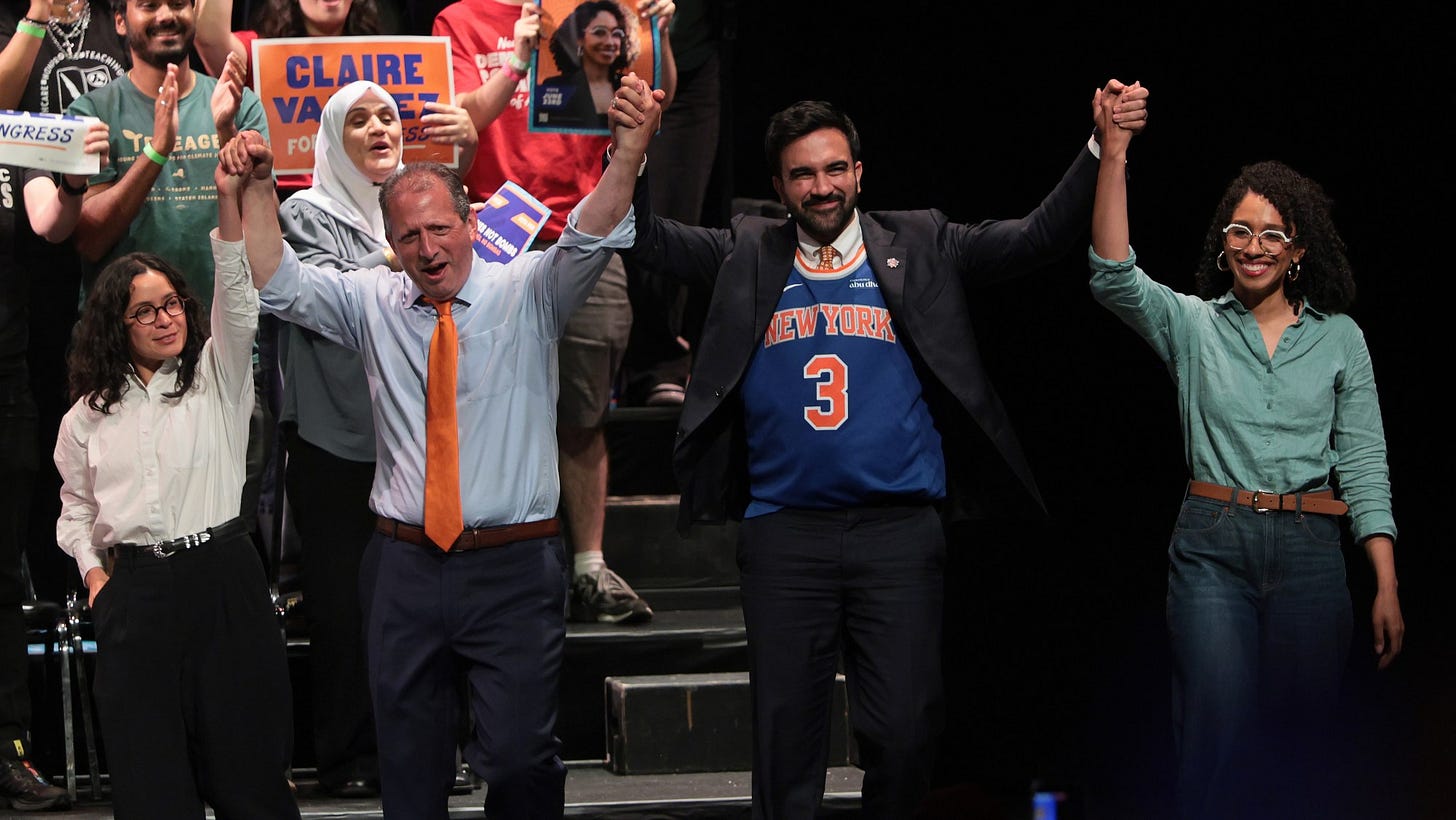 From left, New York left-wing Congressional candidate Claire Valdez, New York Congressional candidate Brad Lander, New York mayor Zohran Mamdani, and New York congressional candidate  Darializa Avila Chevalier raise their hands during a rally at King's Theater on June 18, 2026 in New York City. All four were winners of some kind or another on Primary Tuesday.