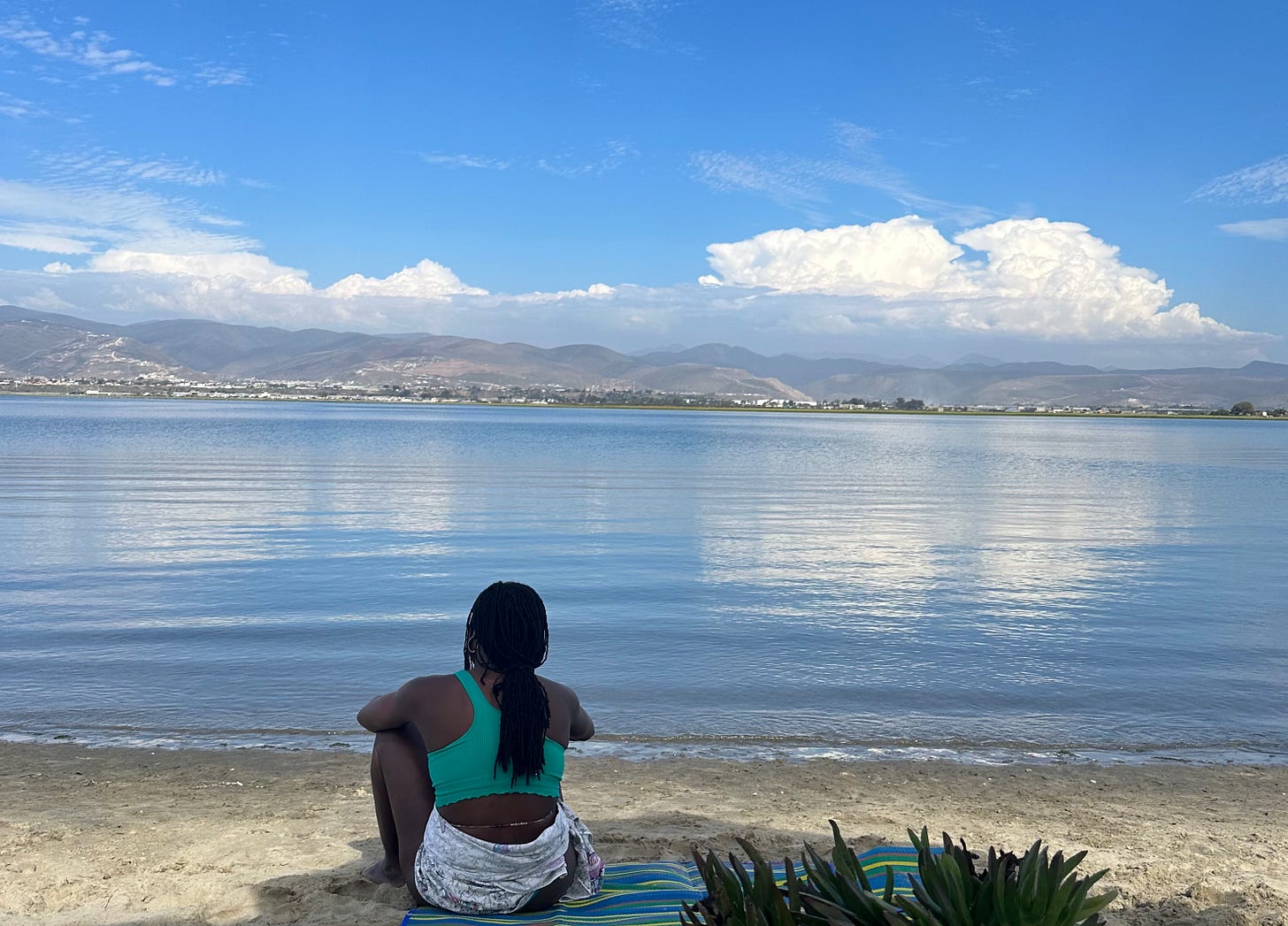 Black woman with locs looking on beautiful view