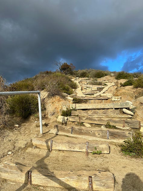 Two steep, winding staircases and a ridge through the middle of the trail at Runyon Canyon to show the difficulty of the hike.