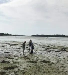Dr. Corina Ciocan and others taking samples at Chichester Harbour, UK. Dr. Ciocan found alarming levels of fiberglass particles in marine bivalves collected near active boatyards on the south coast of England. (Photo/ Angie Richard) Dr. Corina Ciocan and others taking samples at Chichester Harbour, UK. Dr. Ciocan found alarming levels of fiberglass particles in marine bivalves collected near active boatyards on the south coast of England. (Photo/ Angie Richard)