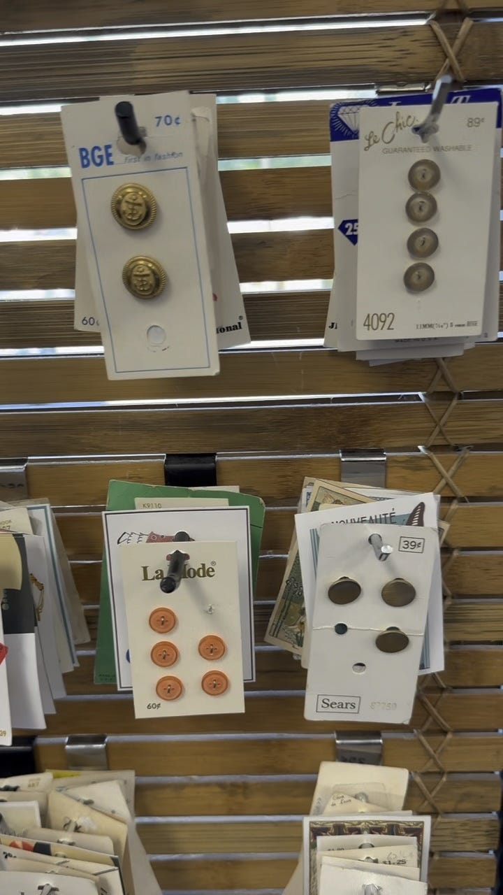 A display of button and vintage linens