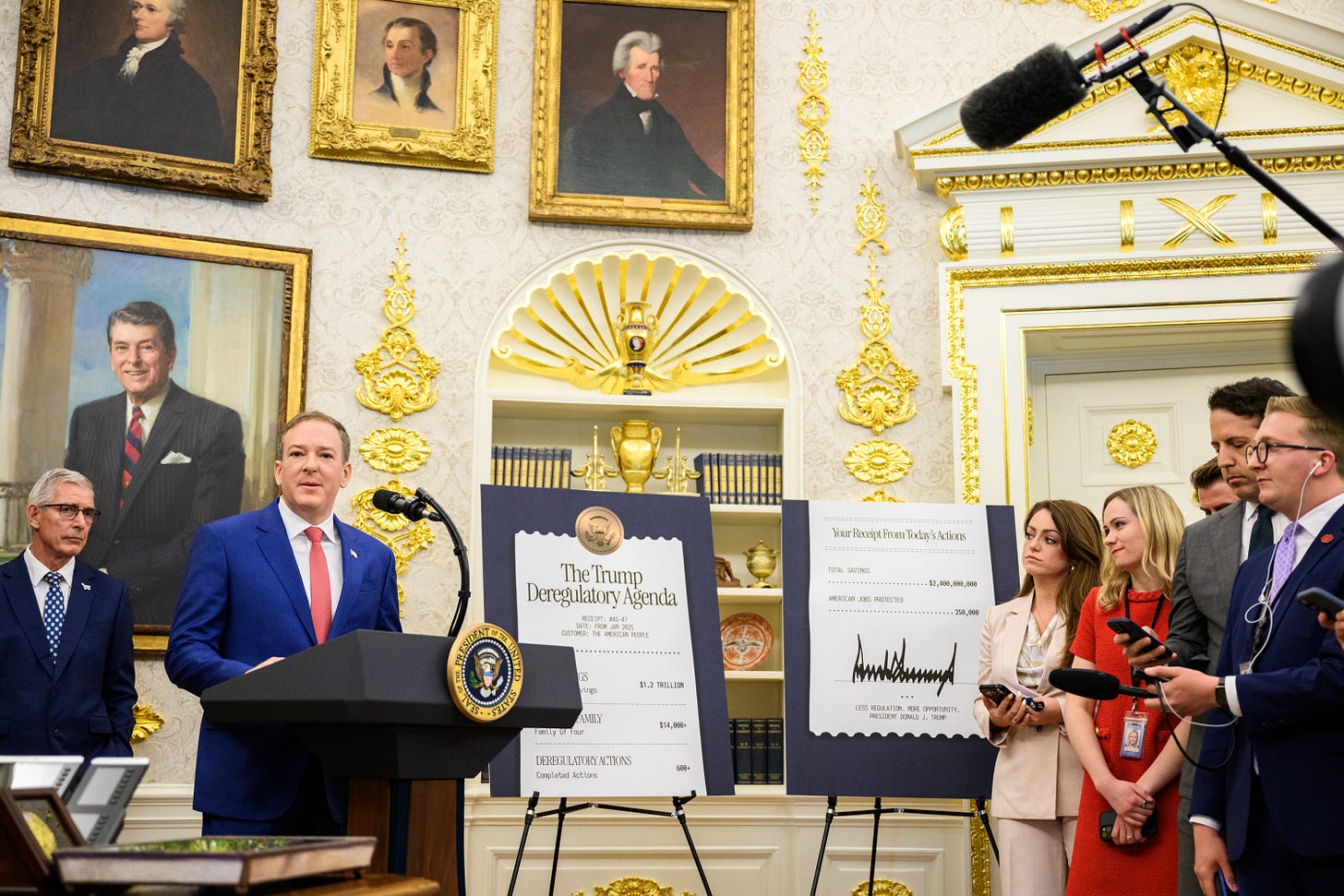 EPA Administrator Lee Zeldin speaks at a lectern in the Oval Office beside a board reading The Trump Deregulatory Agenda