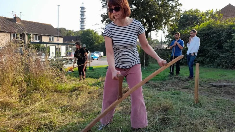 Residents and volunteers scything the meadow at Stanfield Close / Photo : Lockleaze Neighbourhood Trust Residents and volunteers scything the meadow at Stanfield Close / Photo : Lockleaze Neighbourhood Trust