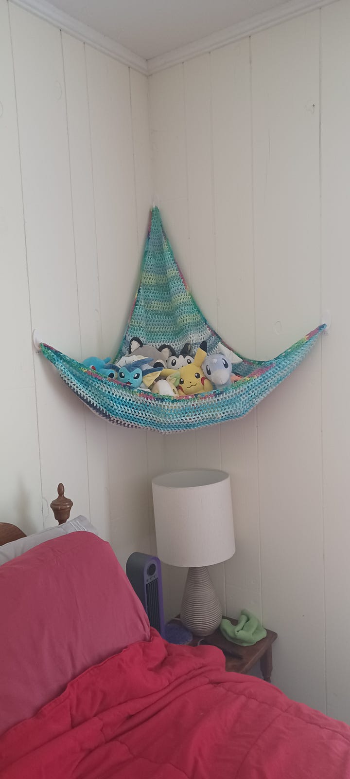 A crocheted toy hammock; the yarn is Lily's Sugar 'N Cream. The hammock has stuffed animals in it; several of which are Pokémon themed.