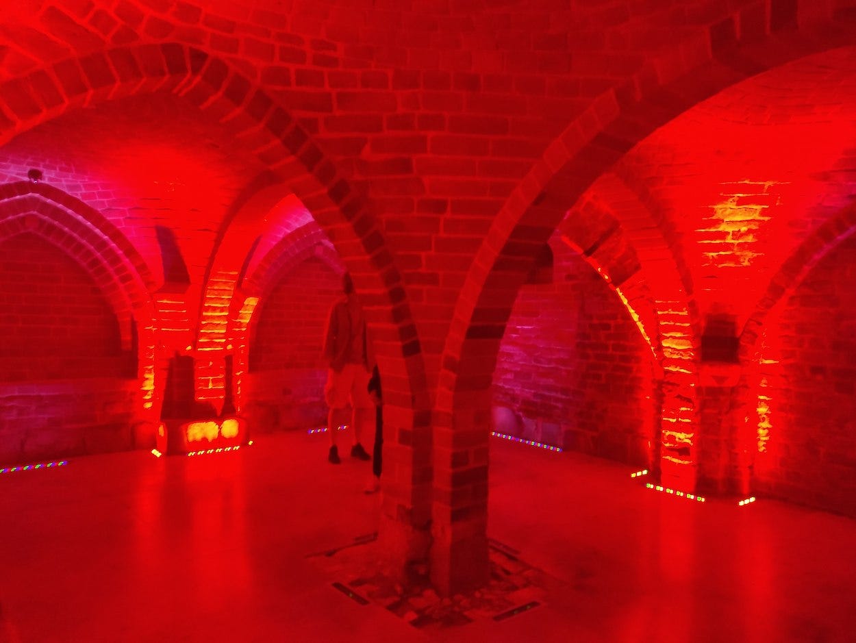 The old dining hall is now bathed in red light