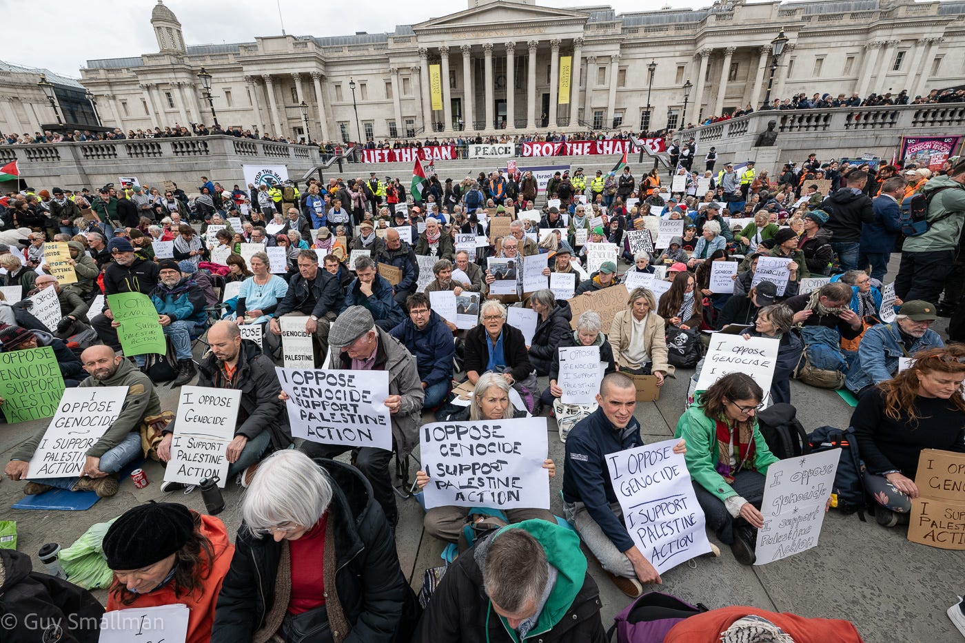 May be an image of one or more people, crowd, the Brandenburg Gate and text