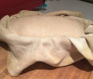  In my early morning dark kitchen, puffed out of the banneton and ready to bake! 