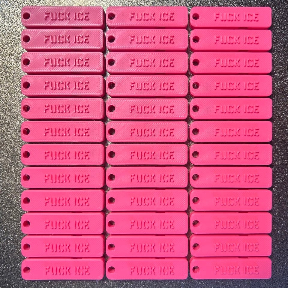 36 hot pink whistles that say FUCK ICE fresh off a 3D printer. 36 hot pink whistles that say FUCK ICE fresh off a 3D printer.