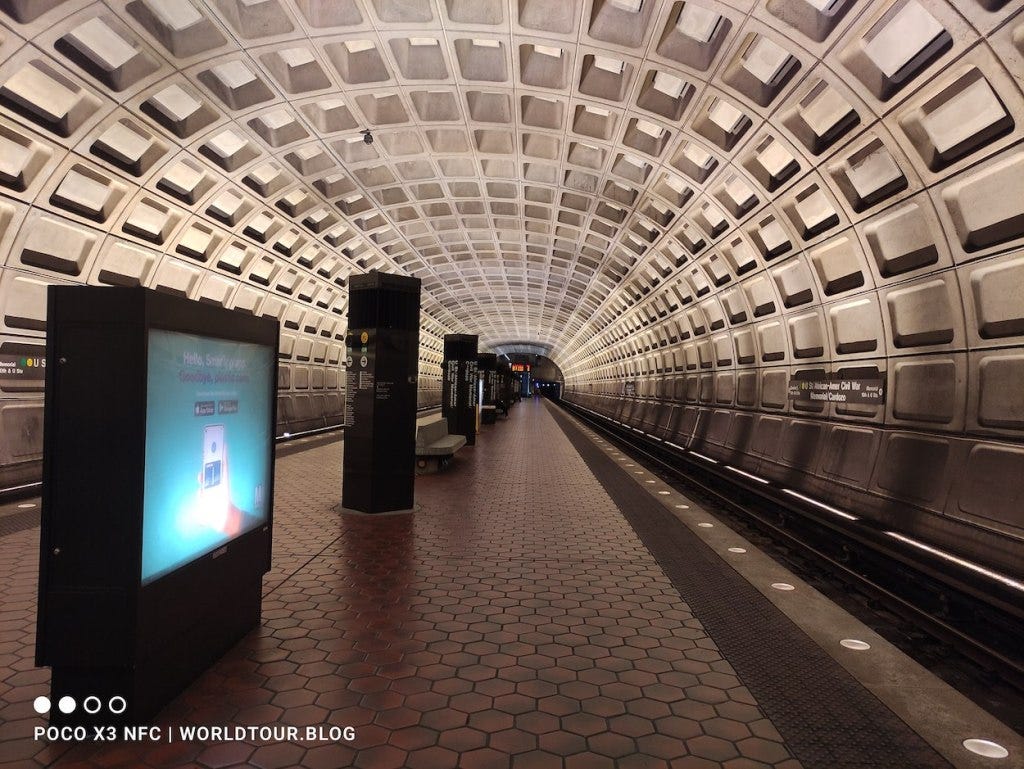 A curved roof with rectangular concrete markings on the DC Metro at the long-named U Street/African-American Civil War/Cardozo