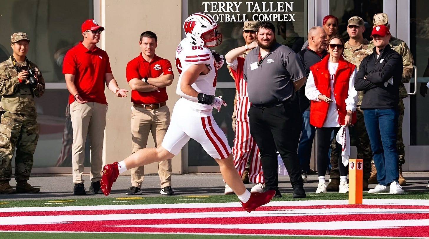 Lance Mason catches a touchdown pass from Carter Smith for Wisconsin at Memorial Stadium. Lance Mason catches a touchdown pass from Carter Smith for Wisconsin at Memorial Stadium.