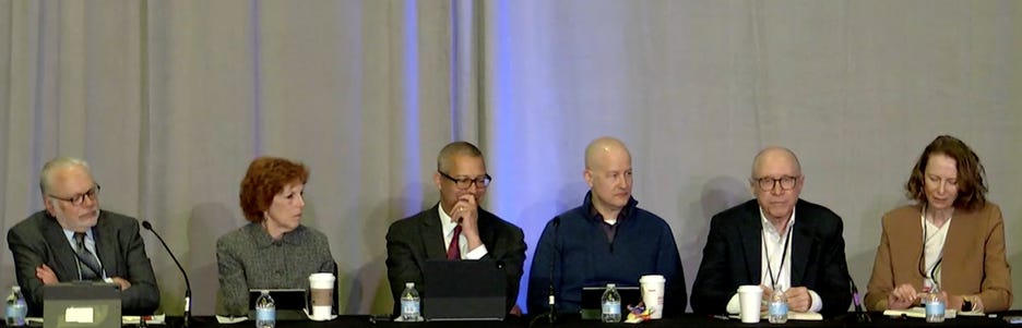 A couple of men sitting at a table

AI-generated content may be incorrect.