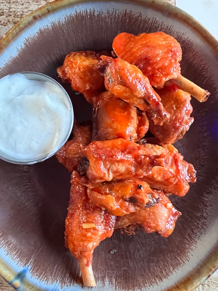 Watkins branch bourbon and brasserie truffle fries and buffalo wings