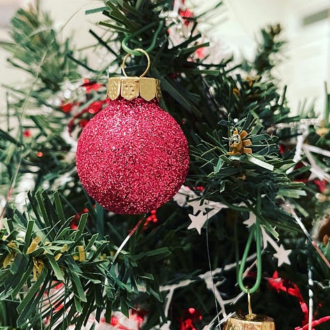 A variety of images, including flowers, a lost hair ornament, a chalk drawing, and a Christmas ornament.