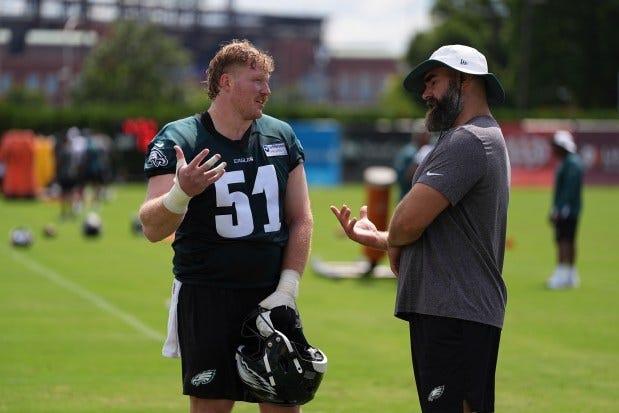 Philadelphia Eagles center Cam Jurgens, left, speaks with retired Eagle Jason Kelce, whom he replaced, during training camp on Wednesday, July 23, 2025, in Philadelphia. (AP Photo/Matt Rourke) Philadelphia Eagles center Cam Jurgens, left, speaks with retired Eagle Jason Kelce, whom he replaced, during training camp on Wednesday, July 23, 2025, in Philadelphia. (AP Photo/Matt Rourke)