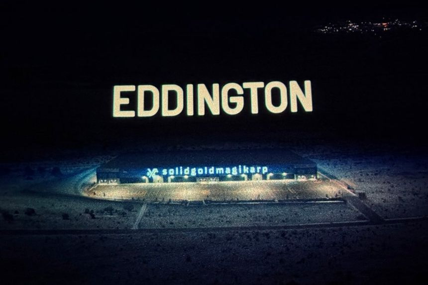 Screenshot from Eddington showing a large building with a sign that reads "Solidgoldmagikarp."