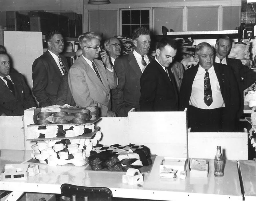 Group of men inside Tricnit hosiery mill