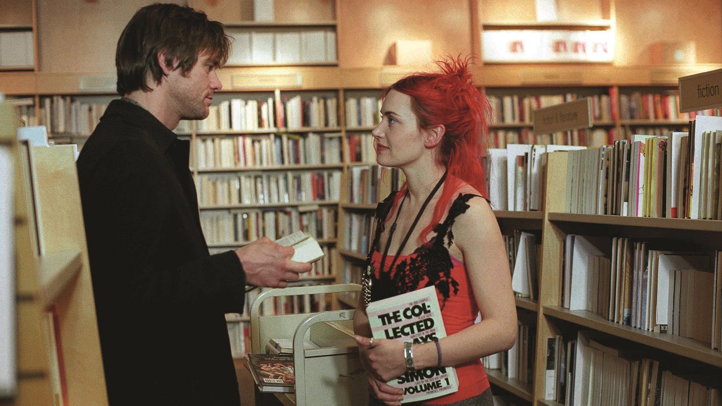 Eternal Sunshine of the Spotless Mind | Still features Jim Carrey as Joel Barish looking lovingly into the eyes of Kate Winslet as Cleentine Kruczynski in a bookstore. Eternal Sunshine of the Spotless Mind | Still features Jim Carrey as Joel Barish looking lovingly into the eyes of Kate Winslet as Cleentine Kruczynski in a bookstore.