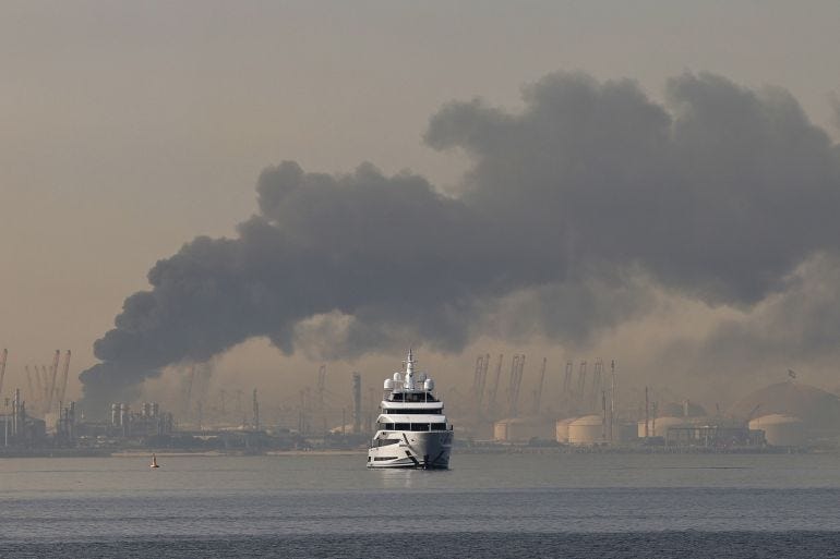 A plume of smoke rises from the port of Jebel Ali A plume of smoke rises from the port of Jebel Ali