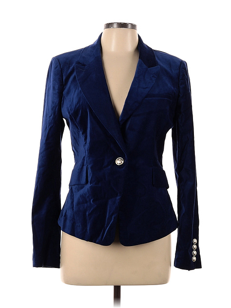 A pink and blue long sleeve quilted jacket, a pair of gold hoop earrings, and a women's single breasted navy velvet blazer.
