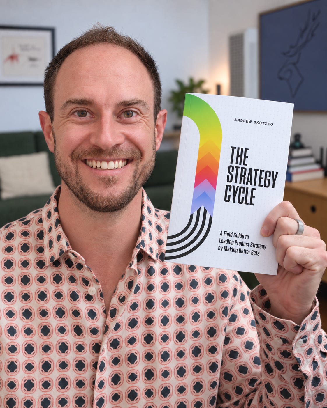 Andrew Skotzko holding a copy of The Strategy Cycle Andrew Skotzko holding a copy of The Strategy Cycle