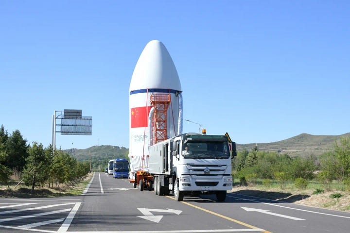 The Long March 6A's fairing and second-stage heading to and being lifted onto Launch Complex 9A.
