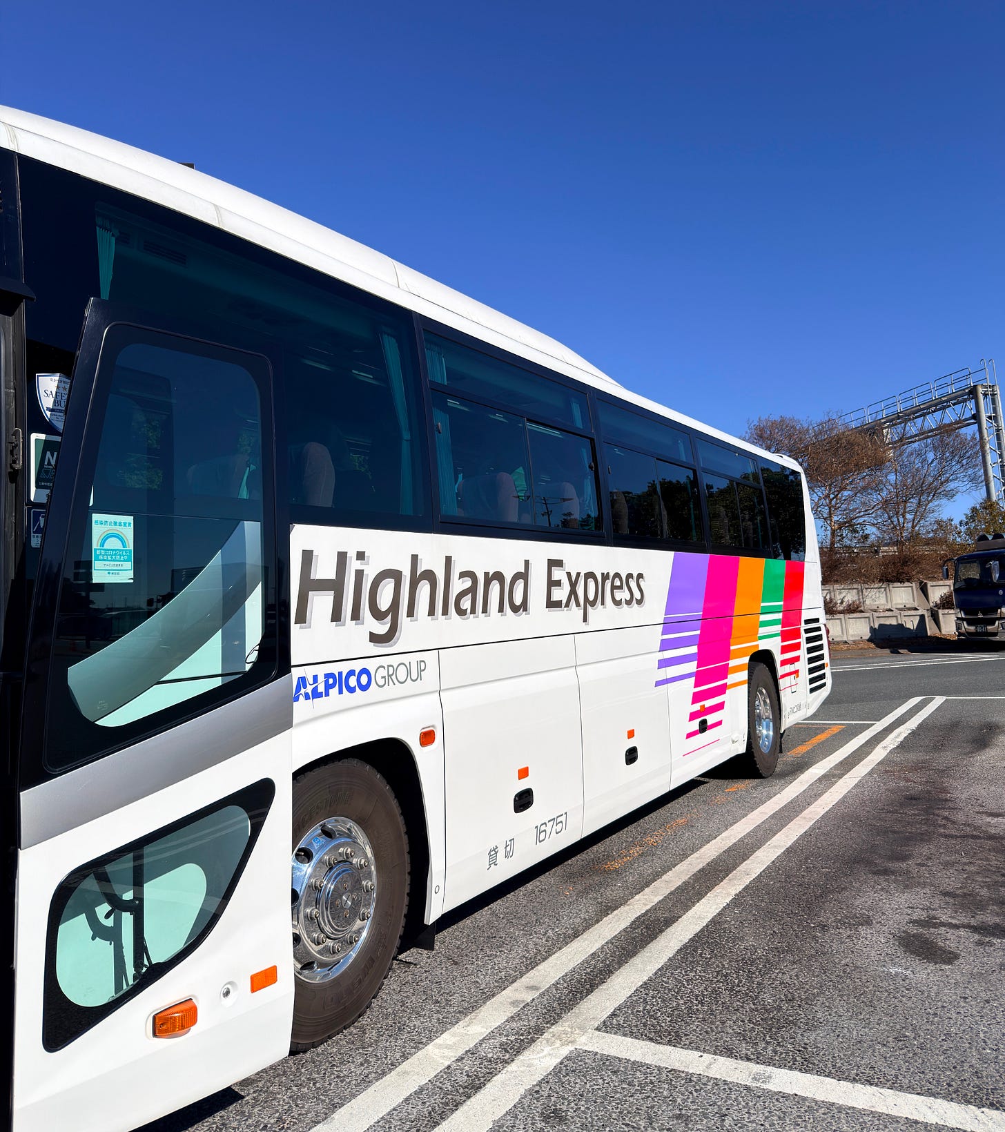 White Highland Express charter bus exterior White Highland Express charter bus exterior