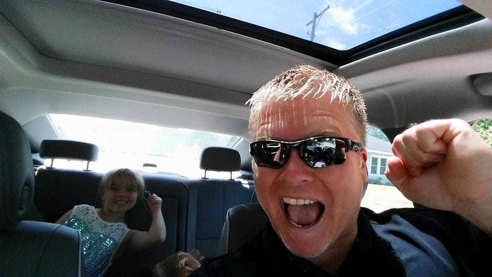 Oakley with his daughter. Courtesy of Justin Oakley. ---------------------------------