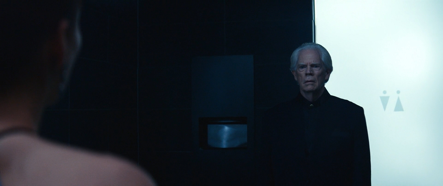 Jame Eagan looking at Helly pretending to be Helena