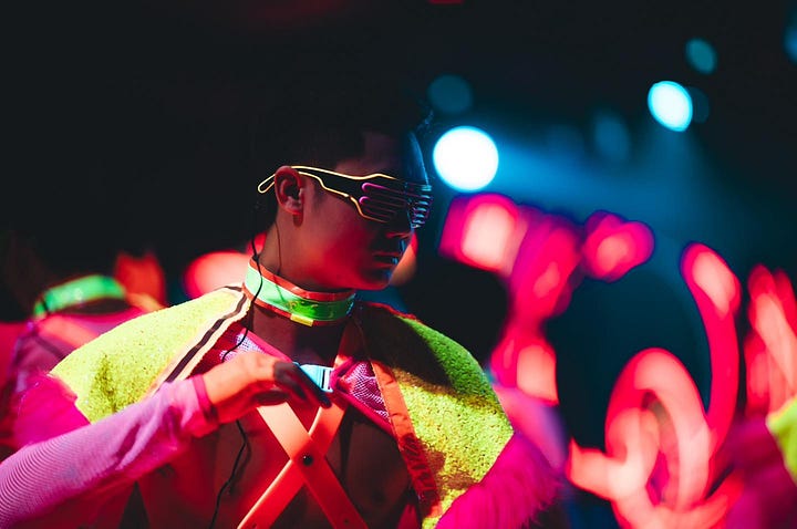 A vogue dance eggs on the crowd at Go Grrls and a neon lit go-go boy dances at Fake Club