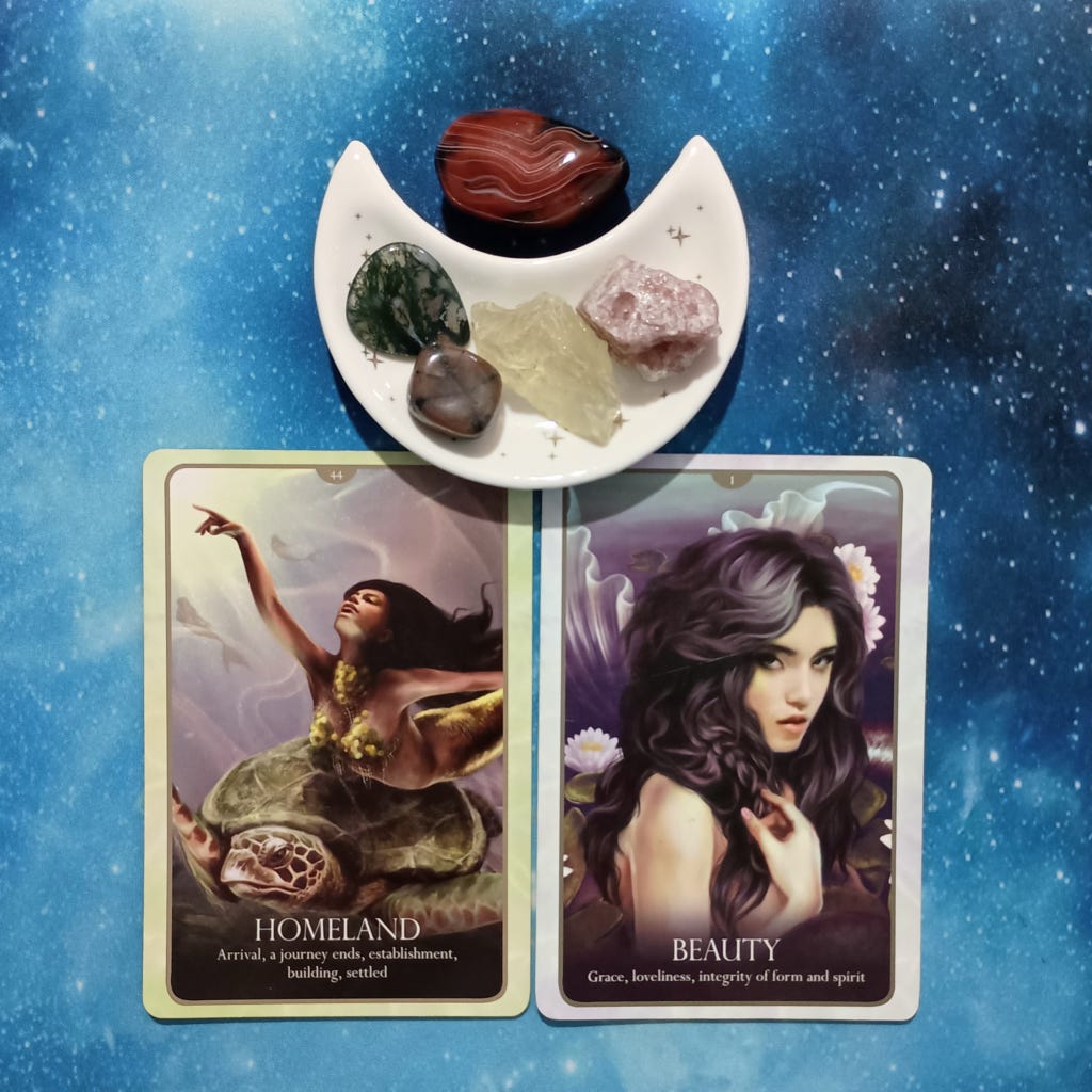 Build from the Heart: A Message From the Universe, 2 Oracle of the Mermaids cards and crystals on a starry blue background Build from the Heart: A Message From the Universe, 2 Oracle of the Mermaids cards and crystals on a starry blue background