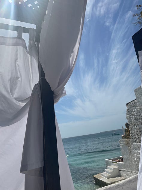 White cabana with a beach view