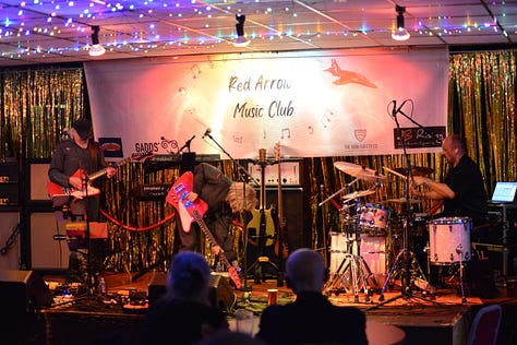Various images of a music concert with bass, electric guitars and drums and a man and a woman singing