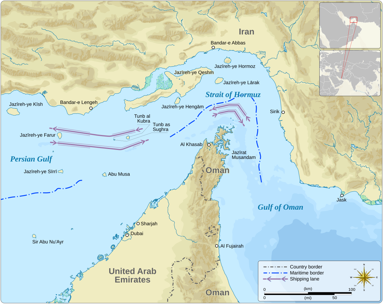 A detailed map of the Strait of Hormuz showing the narrow waterway connecting the Persian Gulf to the Gulf of Oman. Iran occupies the entire northern coastline, with the Omani exclave of Musandam and the United Arab Emirates to the south. Pink arrows mark the shipping lanes running in both directions through the strait, illustrating how vessels must navigate through waters bordered by Iranian territory. An inset map in the upper right shows the regional context, placing the strait within the broader Middle East. The scale indicates the strait is approximately 50 kilometres wide at its narrowest point.