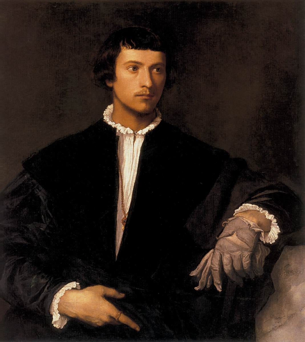 Young man holding one glove Young man holding one glove