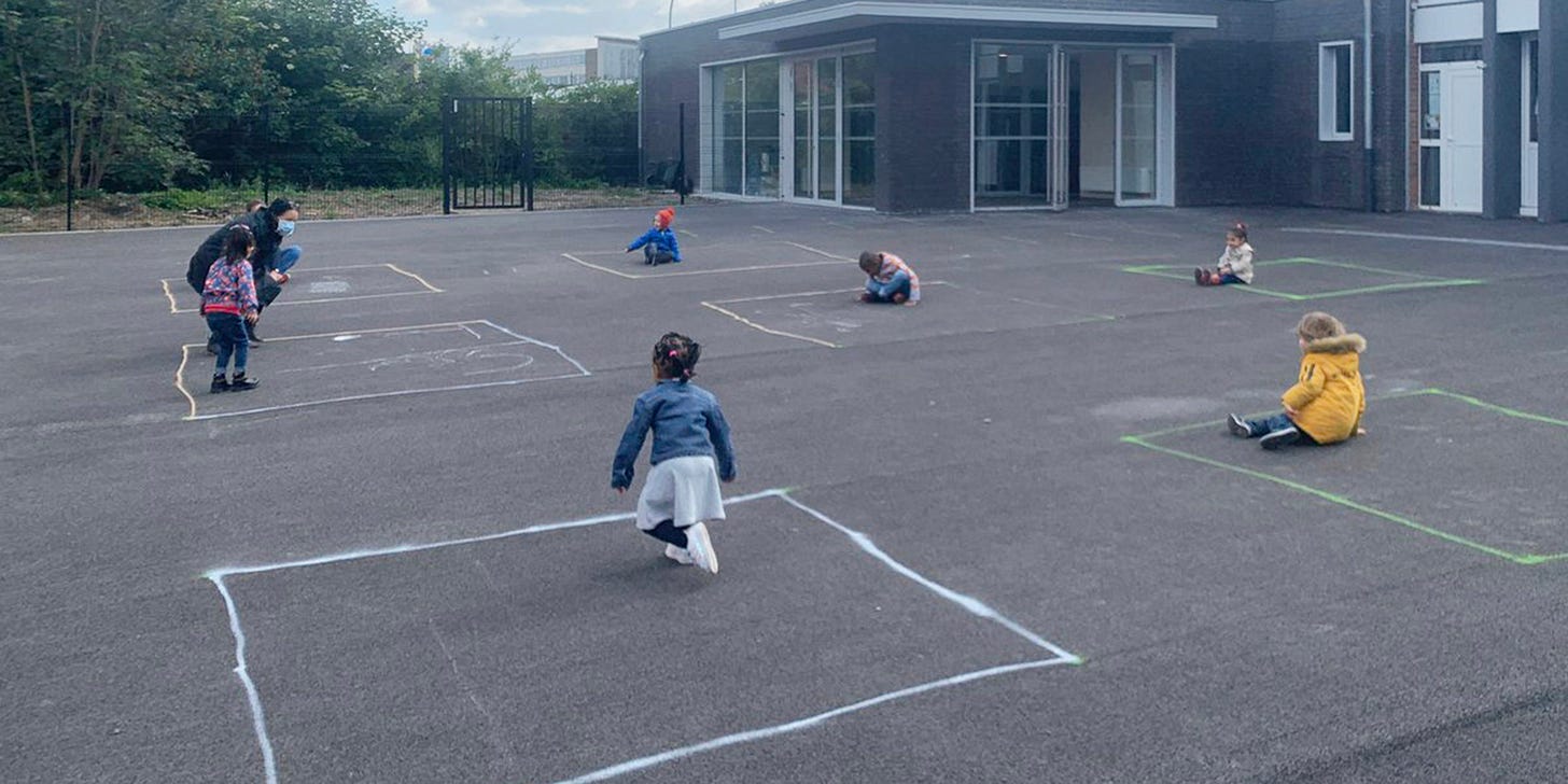 Photo shows French children playing in chalk squares