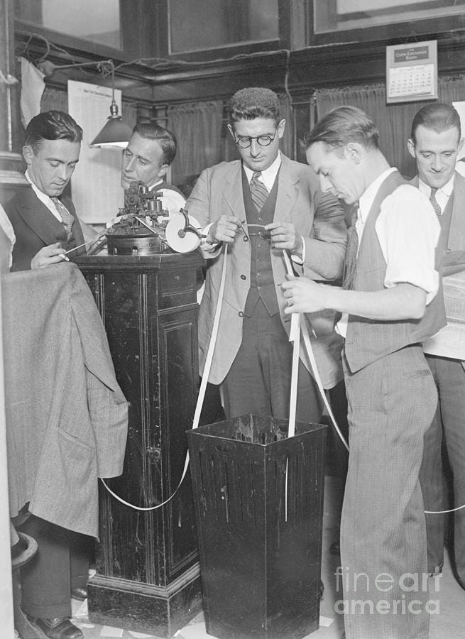 Stock Market Workers Look @ Ticker Tape by Bettmann