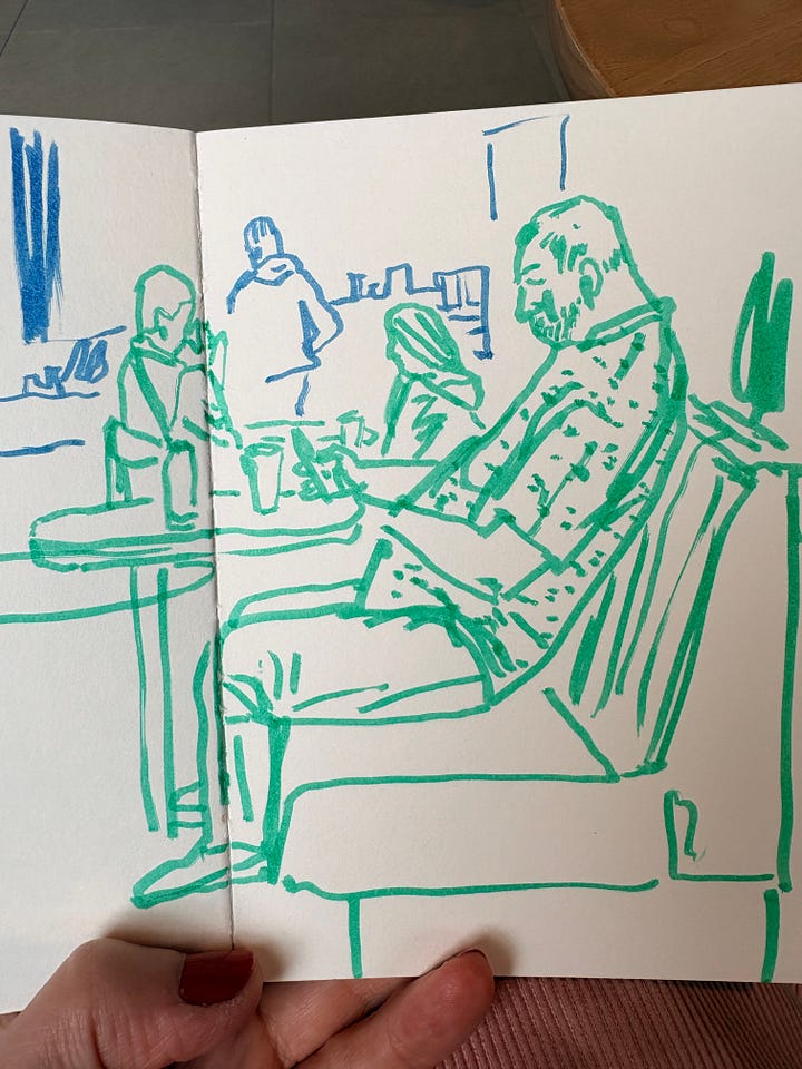 Drawings of men looking at phones drawn from life