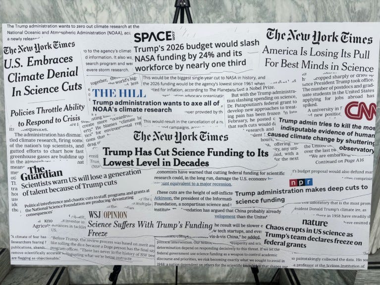 A poster showing cut-outs of headlines from the news media, relating to science grant cuts in the USA.