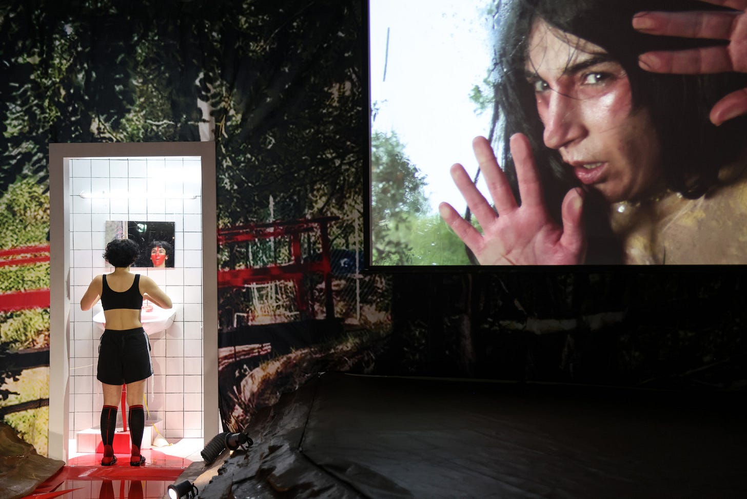 video and vivid stage craft interplay in Schmerz Camp