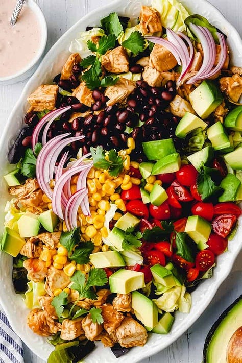 Six dinner salad recipes including Asian coleslaw, Caesar salad with chicken, salmon salad, Southwest chicken salad and a quick taco salad.