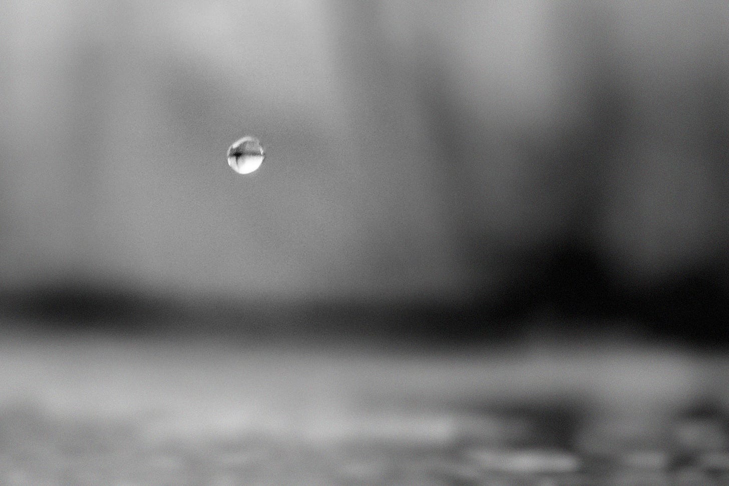 Photo by Ali Hassan: https://www.pexels.com/photo/water-drop-selective-focus-photography-2877038/ | Altered in Photoshop by David C. Roberson