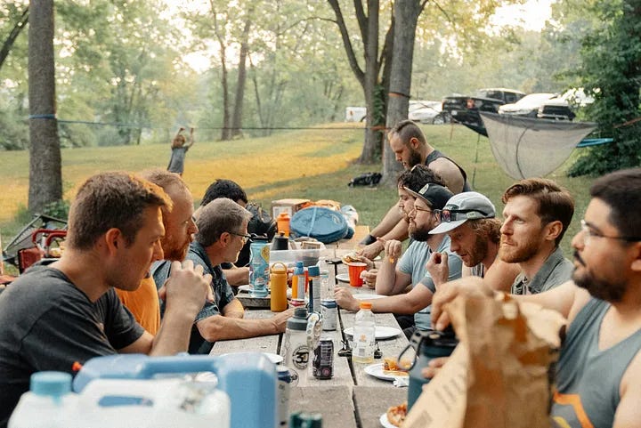 family sitting outdoor eating family sitting outdoor eating