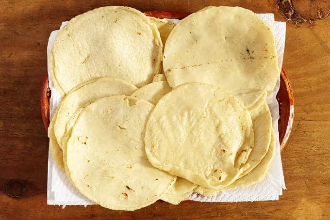 Tortillas draining on paper towels