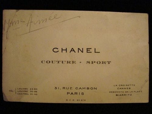 This may contain: an old fashion label with the words chanel couture sport written on it