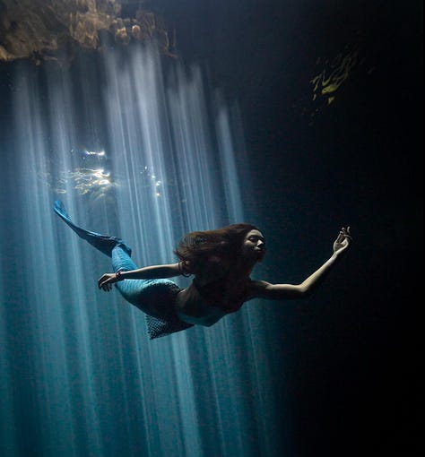 Rachel posing in wetsuit, Rachel posing underwater as Mermaid with light streaks from above, Rachel dressed in lab coat, portrait. 